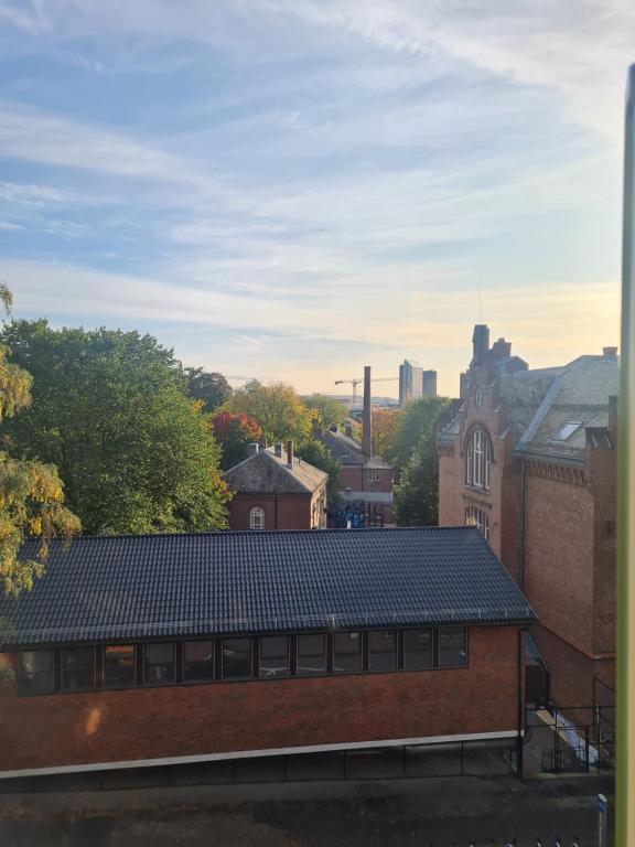 a view from the roof of a brick building at Private room in to roomsapartment (Grunneløkka) in Oslo