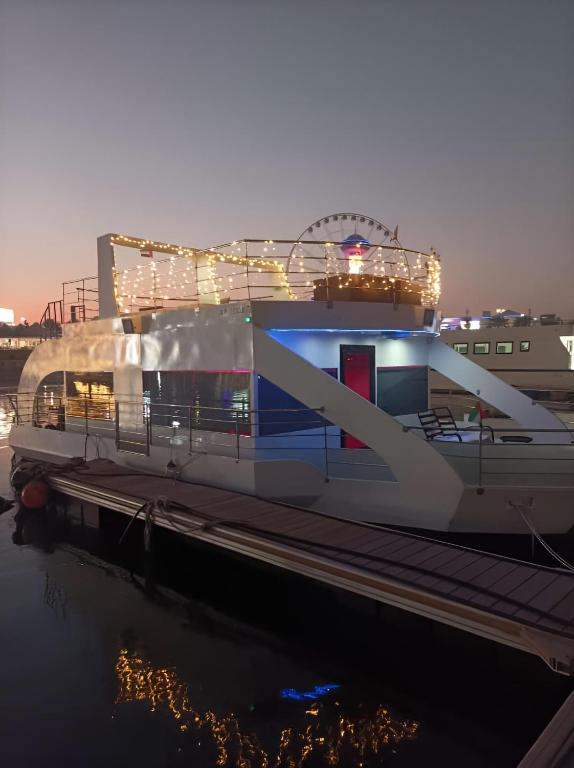 a large boat is docked in the water at Party boat in Abu Dhabi