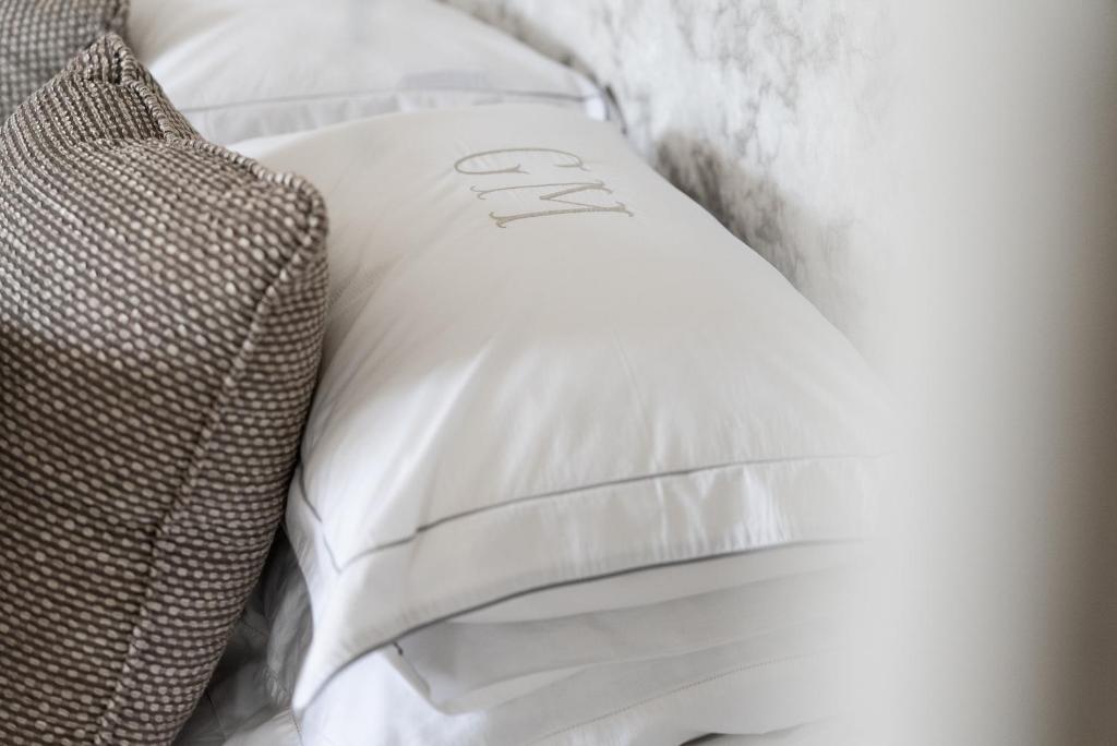 a white pillow with the word sleep written on it at Gileston Manor Luxury B&B in Barry