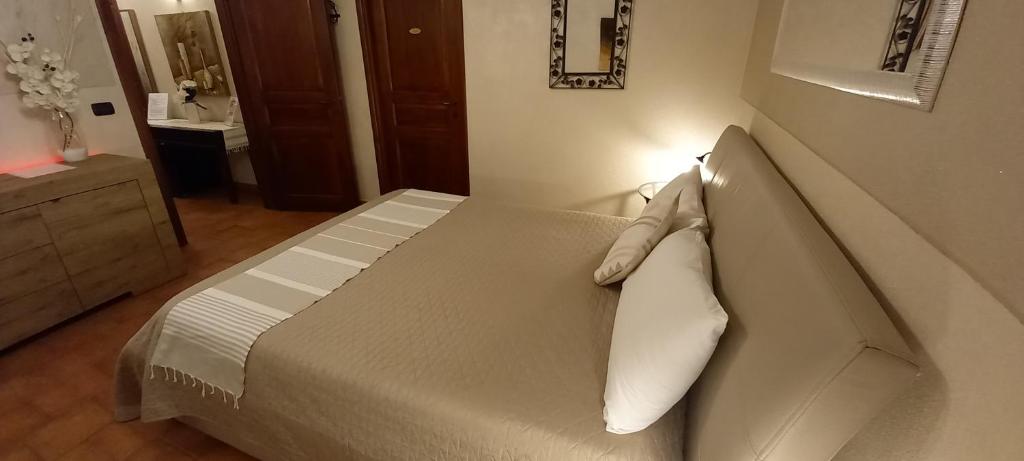Postel nebo postele na pokoji v ubytování GIRASOLE Wellness e Relax