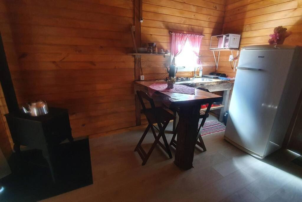 Kuchyň nebo kuchyňský kout v ubytování Cabana no alto do morro