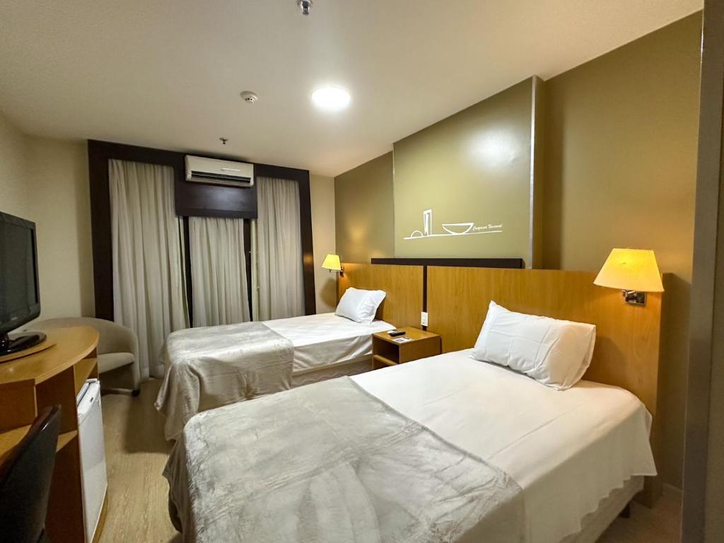 Voodi või voodid majutusasutuse Flat 213 - Comfort Hotel Taguatinga toas