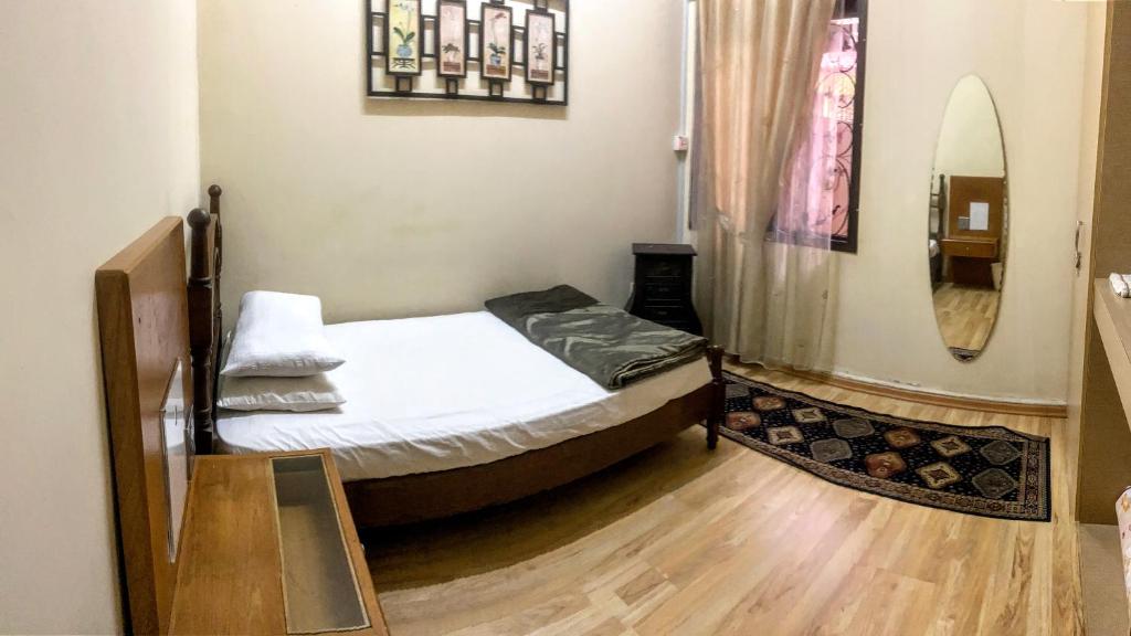 Postel nebo postele na pokoji v ubytování Guesthouse Khatib