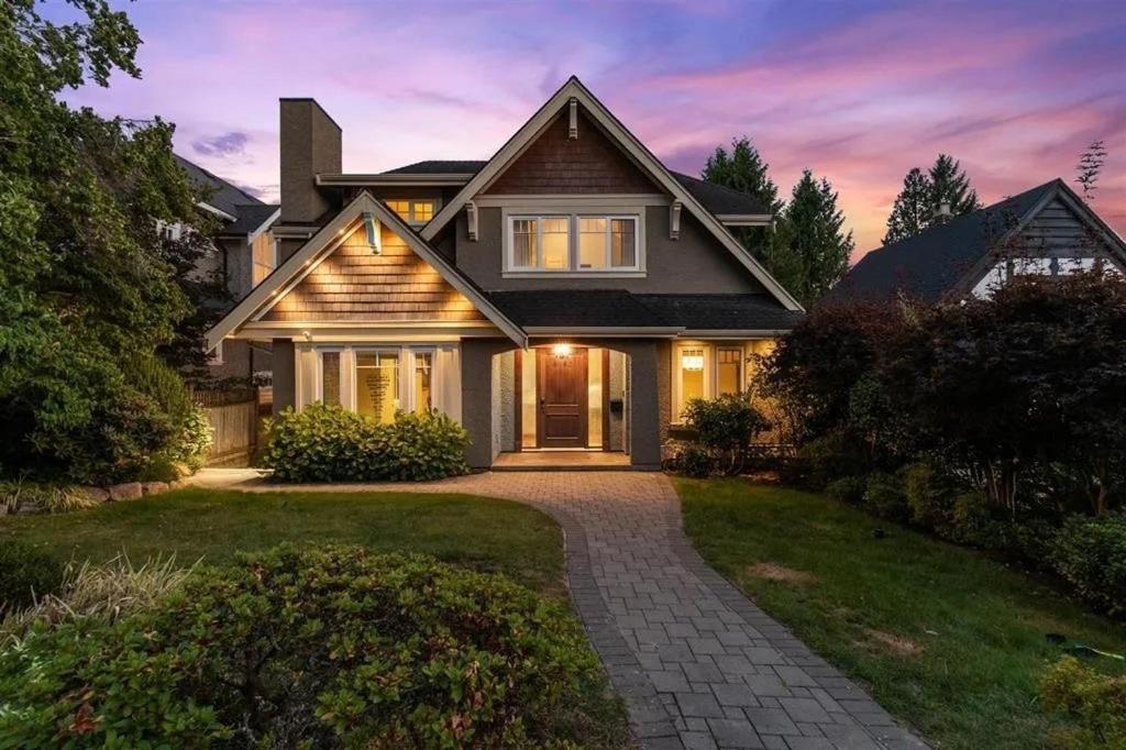 a house with a pathway leading to the front door at Spacious Cozy House in Vancouver West in Vancouver