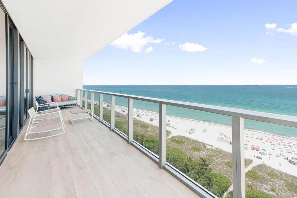 a balcony with a view of the beach at W South Beach in Miami Beach