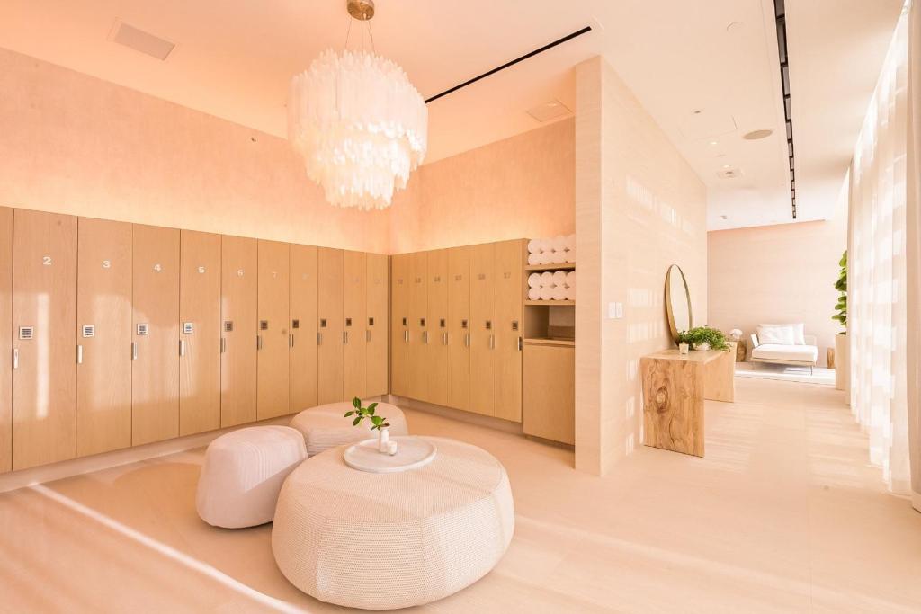 a dressing room with a table and a chandelier at W South Beach in Miami Beach