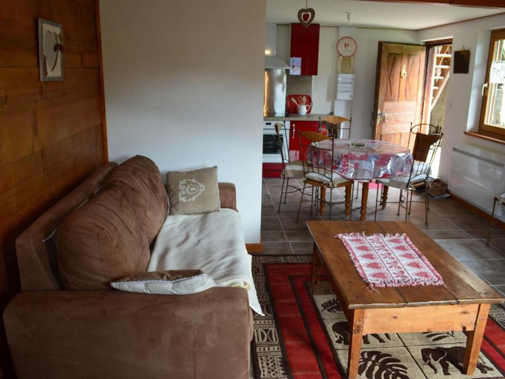 a living room with a couch and a table at Chalet Châtel 2 Pièces, 6 Pers, 2 SDB, Proche Remontées, Balcon, Jardin, Parking - FR-1-676-27 in Châtel
