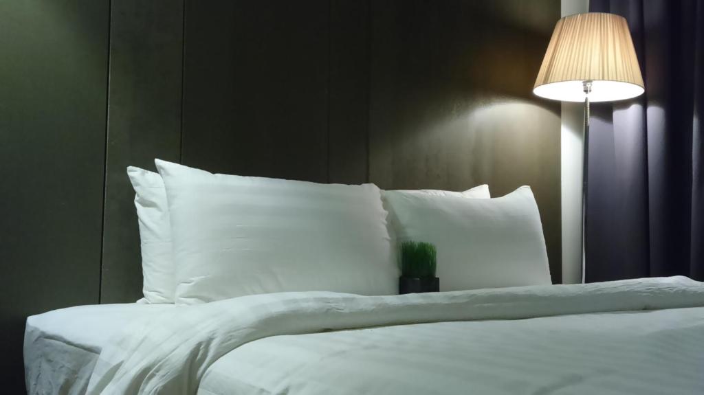 Postel nebo postele na pokoji v ubytování T+ Hotel Butterworth