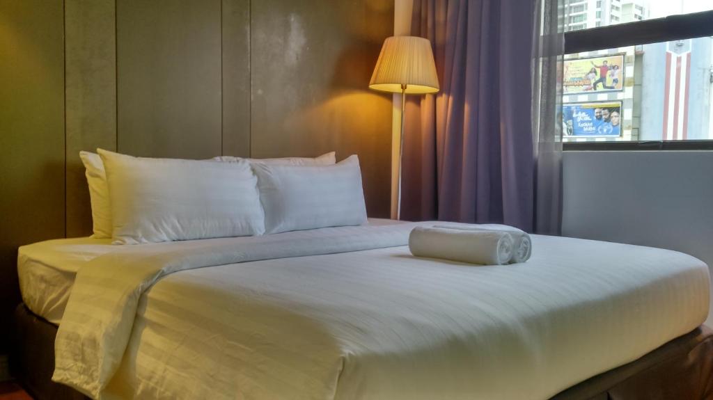 Postel nebo postele na pokoji v ubytování T+ Hotel Butterworth