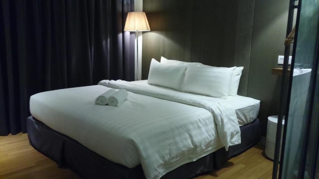 Postel nebo postele na pokoji v ubytování T+ Hotel Butterworth