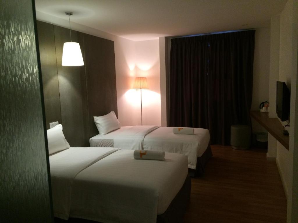 Postel nebo postele na pokoji v ubytování T+ Hotel Butterworth