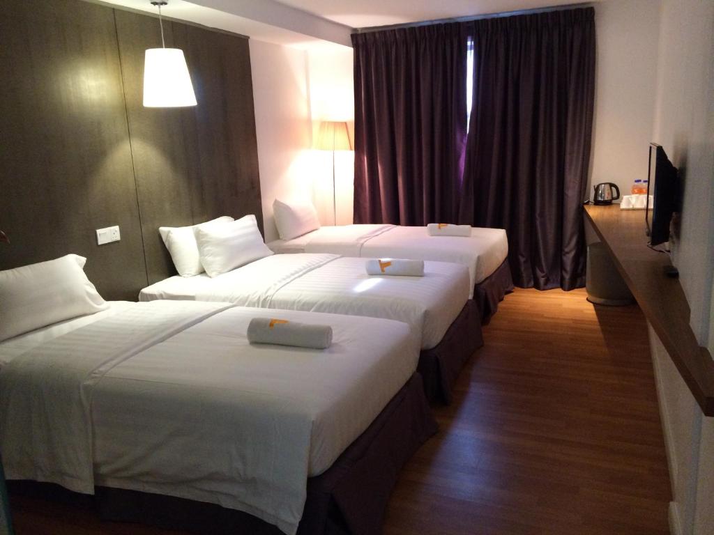 Postel nebo postele na pokoji v ubytování T+ Hotel Butterworth
