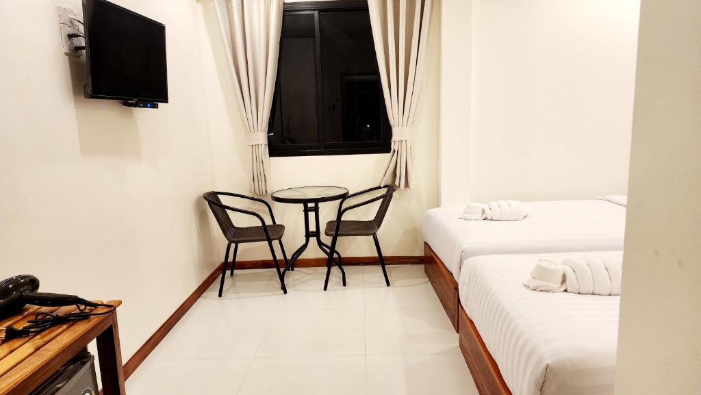Postel nebo postele na pokoji v ubytování Chotika Hotel โรงแรมโชติกา ณ เชียงคาน