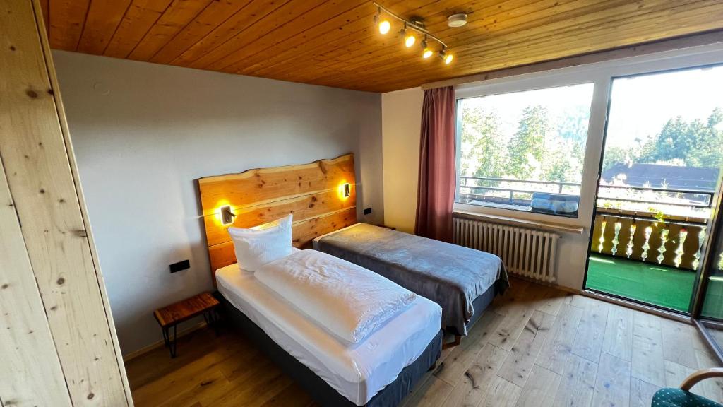 Postel nebo postele na pokoji v ubytování Boutique Hotel and Apartments Pension Sternen
