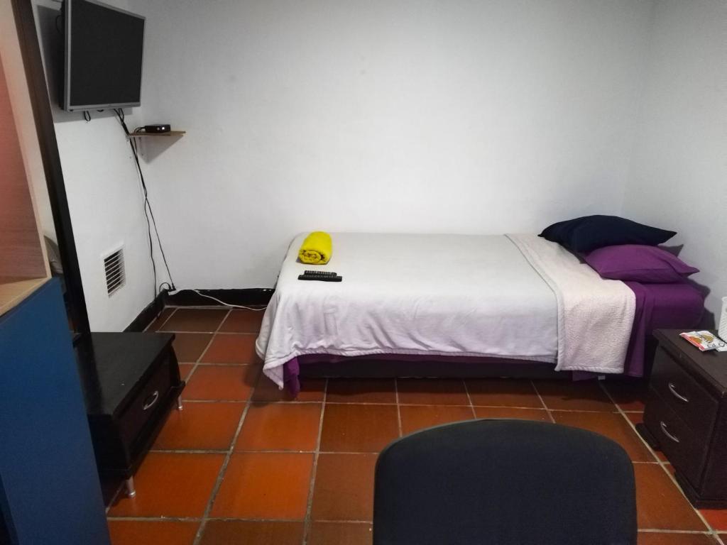 Postel nebo postele na pokoji v ubytování Casa en Bogotá ubicada en zona central