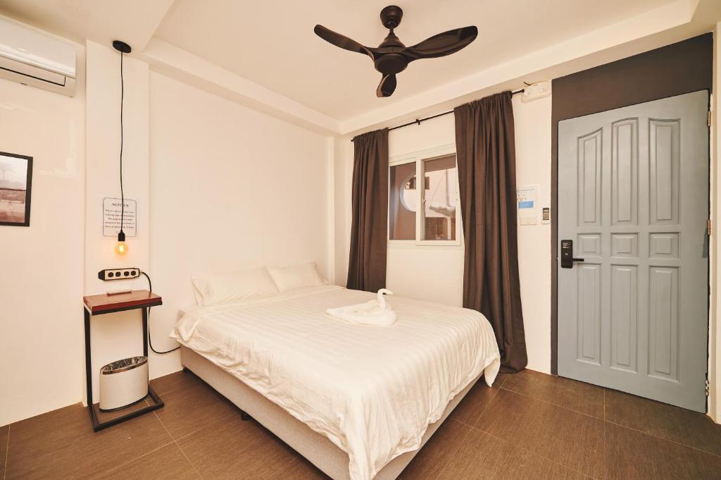 Postel nebo postele na pokoji v ubytování Hotel Gray in Boracay