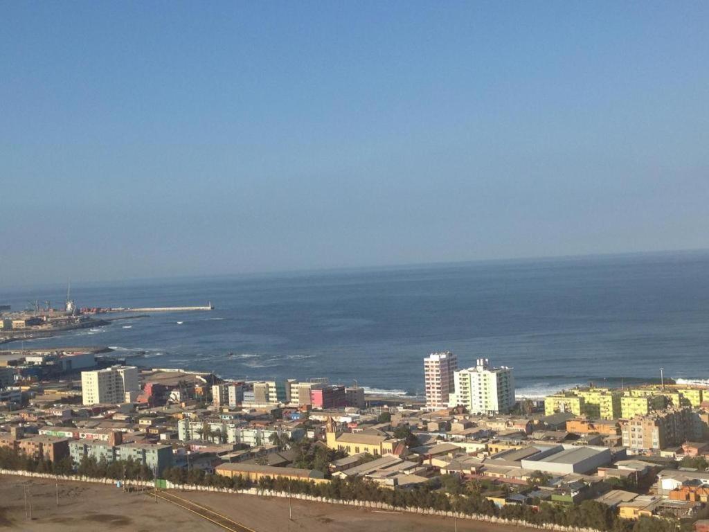 an aerial view of a city and the ocean at VISTA LA CIUDAD Y MAR PISO ALTO 1D in Antofagasta