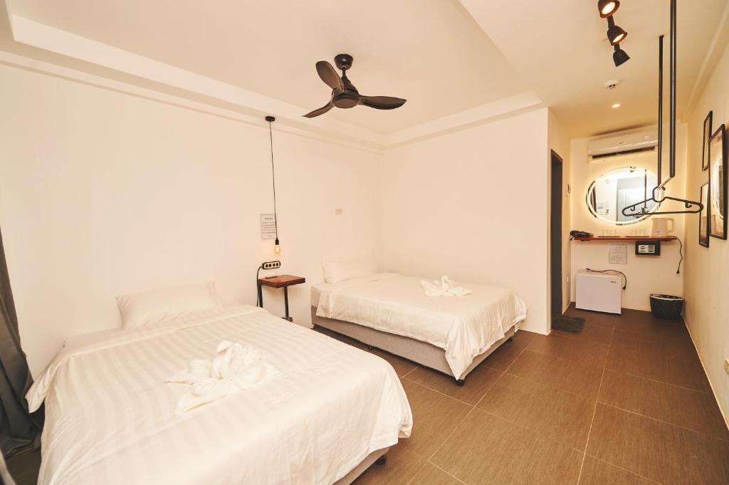 Postel nebo postele na pokoji v ubytování Hotel Gray in Boracay