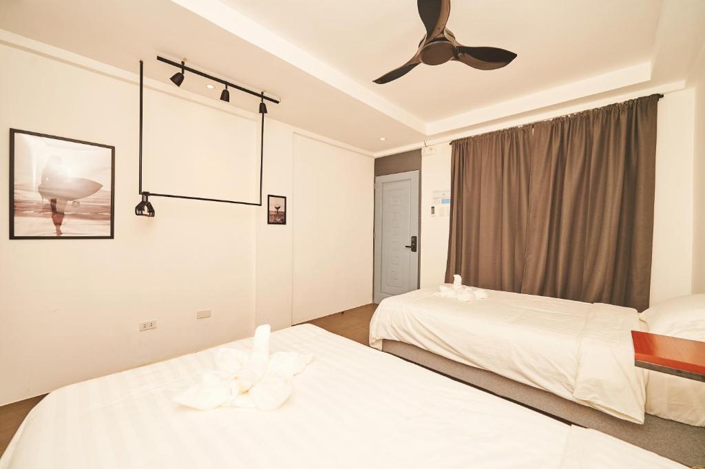 Postel nebo postele na pokoji v ubytování Hotel Gray in Boracay