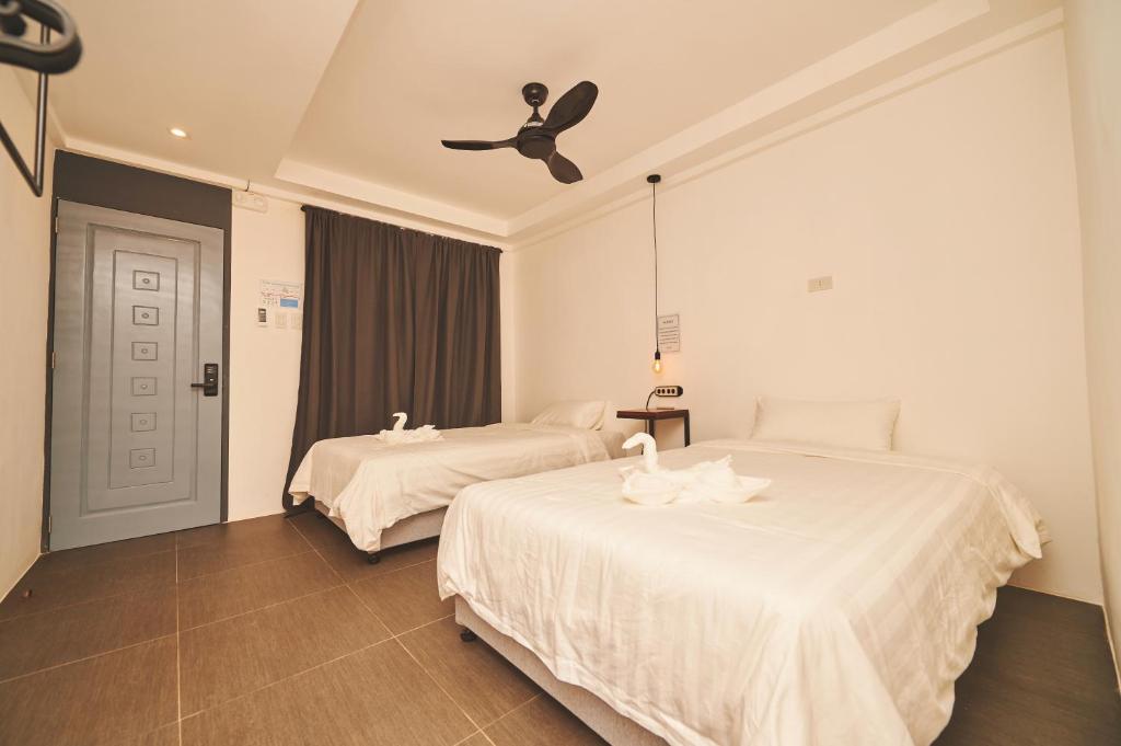 Postel nebo postele na pokoji v ubytování Hotel Gray in Boracay
