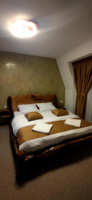 a bedroom with two beds with pillows on them at Villa Perule 2 Вила Перуле in Shumnatitsa