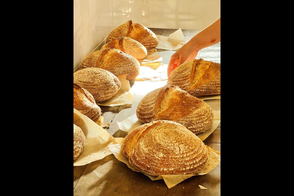 a group of buns sitting on top of a table at Rascals Hotel - Adults Only in Kuta Lombok