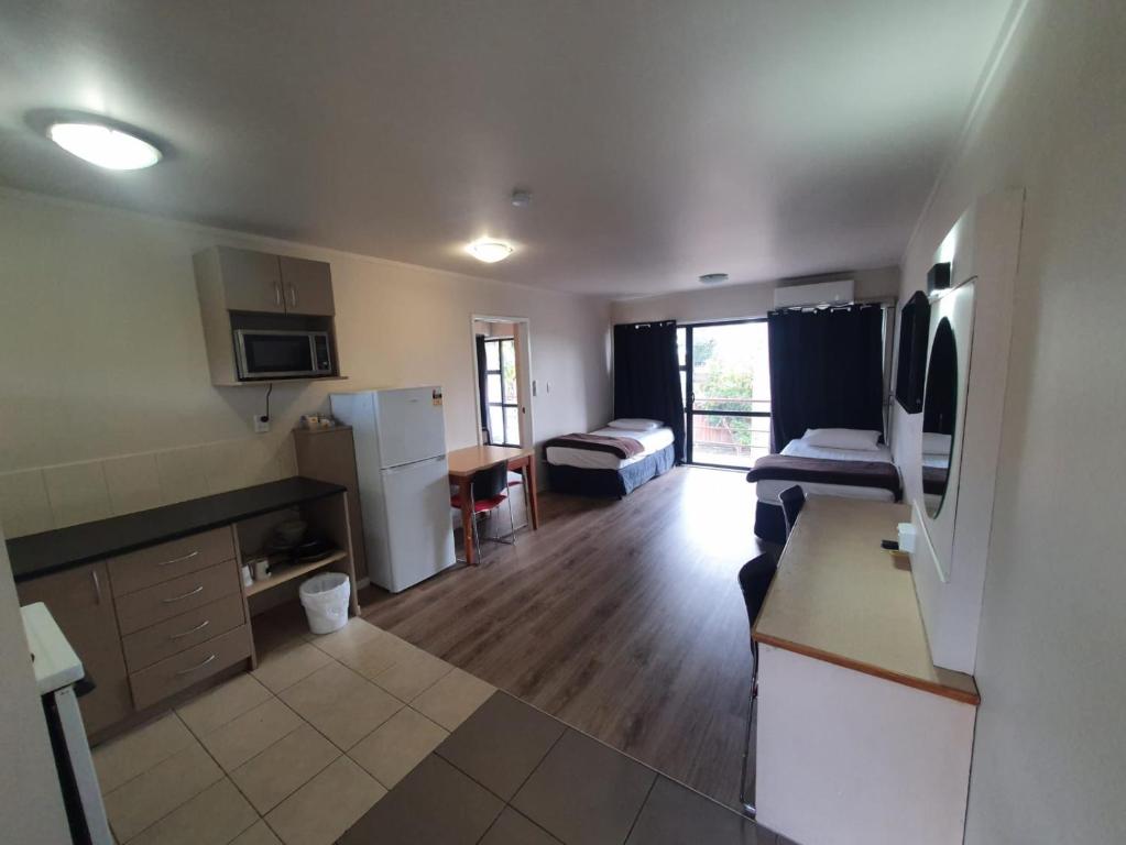 Kuchyň nebo kuchyňský kout v ubytování Ascot Epsom Motel