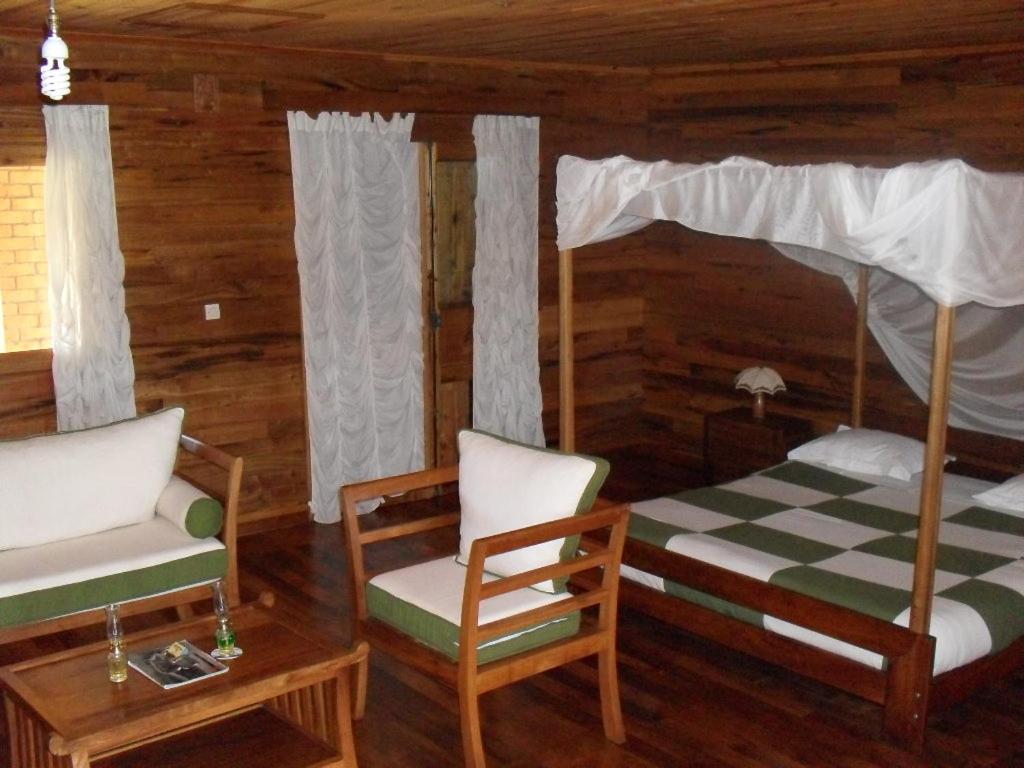 Postel nebo postele na pokoji v ubytování Eulophiella