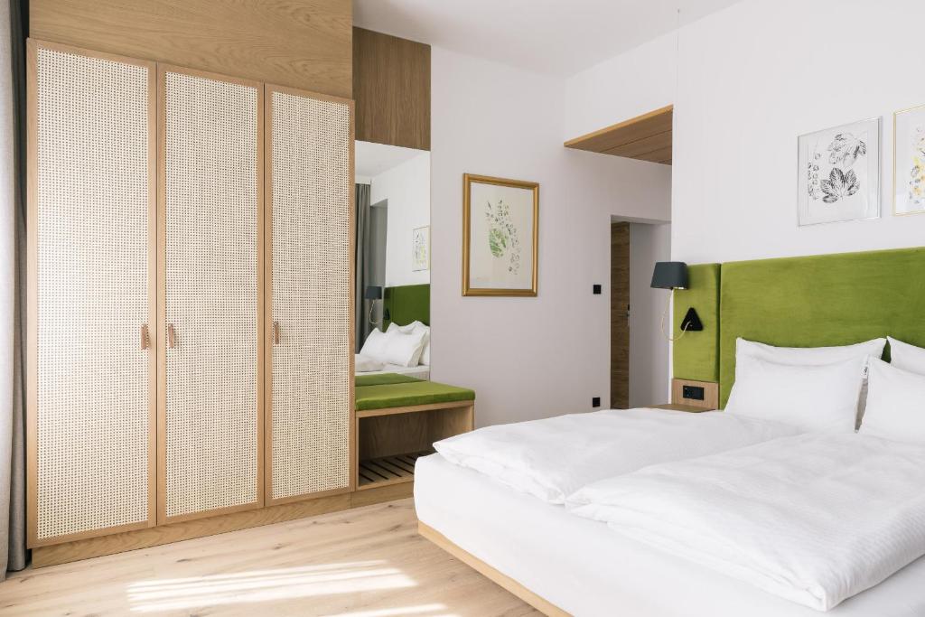 Postel nebo postele na pokoji v ubytování Bio-Hotel Schani Wienblick
