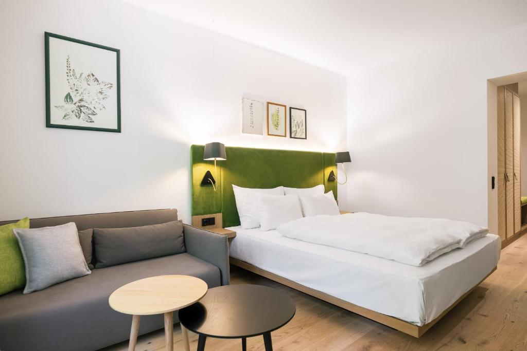 Postel nebo postele na pokoji v ubytování Bio-Hotel Schani Wienblick