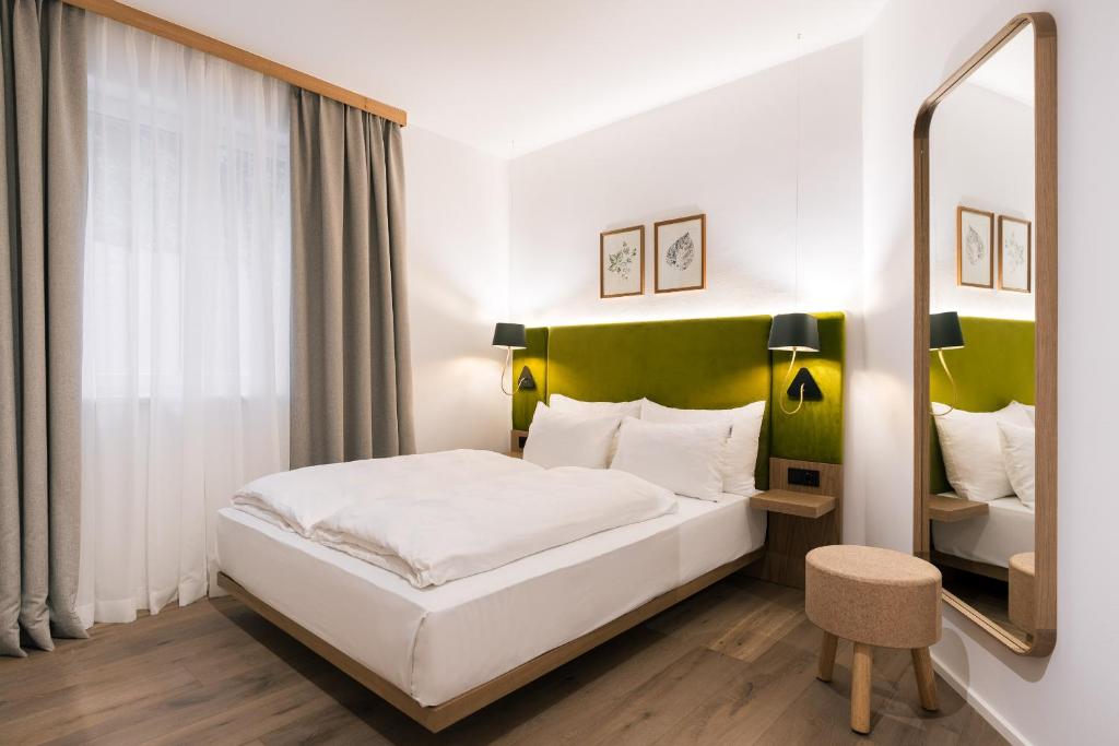 Postel nebo postele na pokoji v ubytování Bio-Hotel Schani Wienblick
