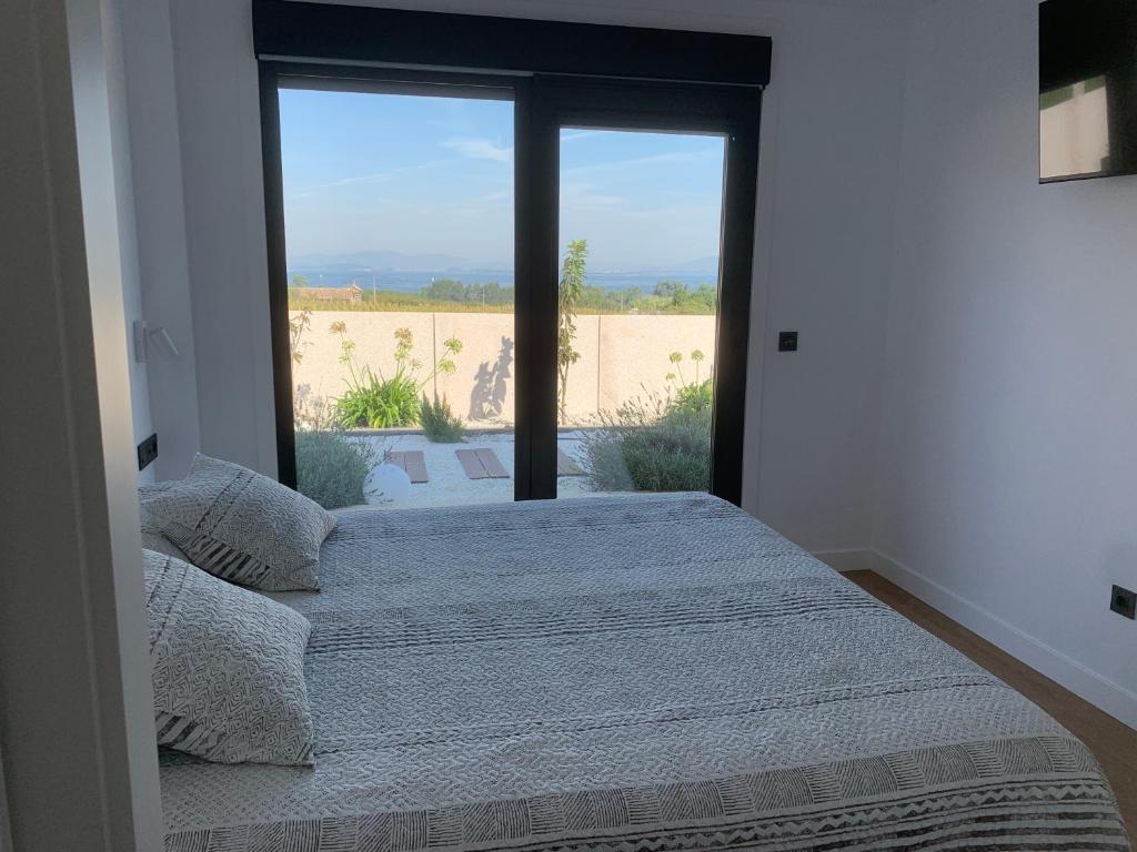 Postel nebo postele na pokoji v ubytování Casa Leiras