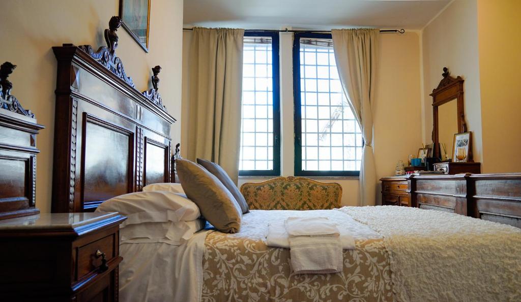 Postel nebo postele na pokoji v ubytování ABBAZIA SS. QUIRICO E GIULITTA