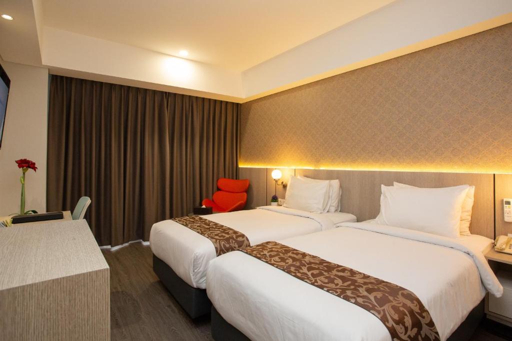 Voodi või voodid majutusasutuse Avissa Suites toas