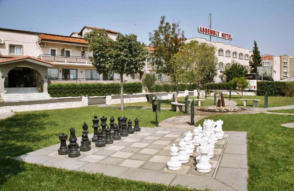 a chess board on a lawn in a park at Assembly Hotel in Anchialos