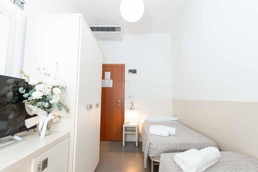 Postel nebo postele na pokoji v ubytování Hotel Saint Louis