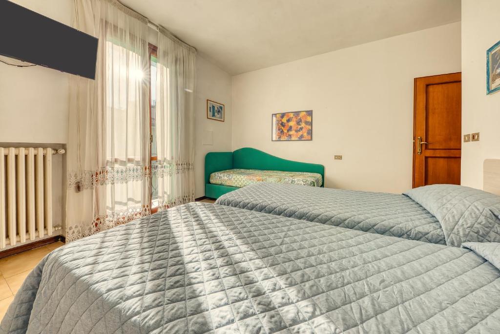 Postel nebo postele na pokoji v ubytování Hotel Residence Charles