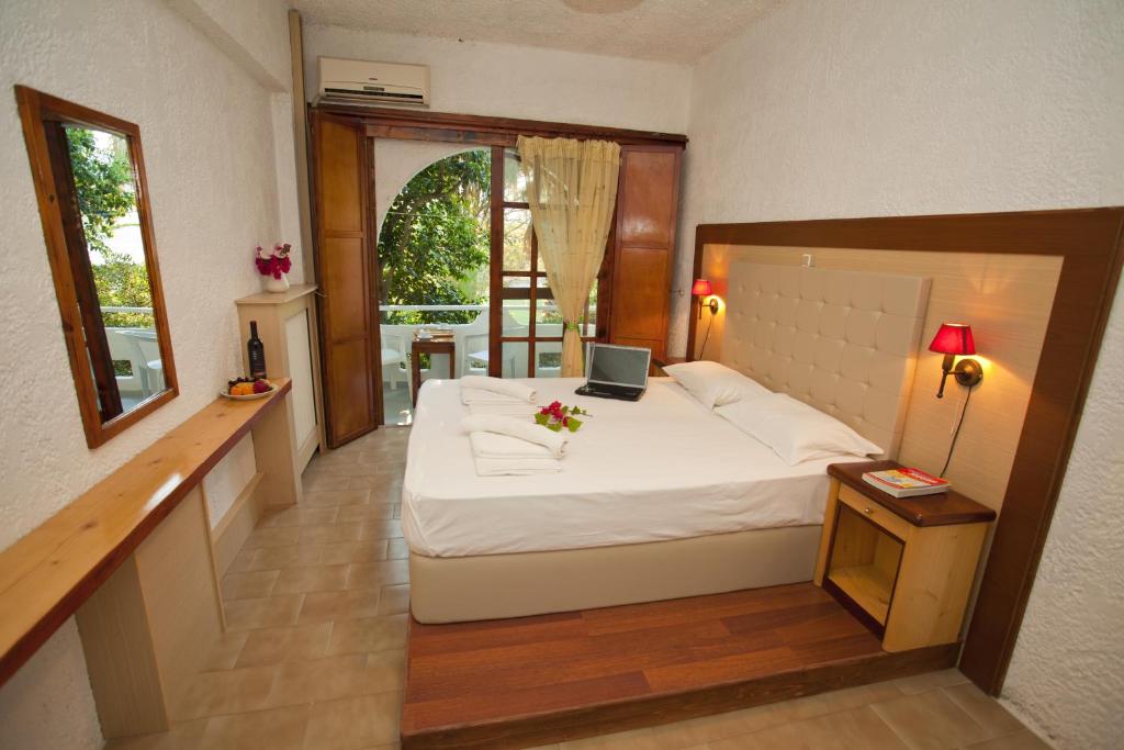 Postel nebo postele na pokoji v ubytování Damnoni Paradise