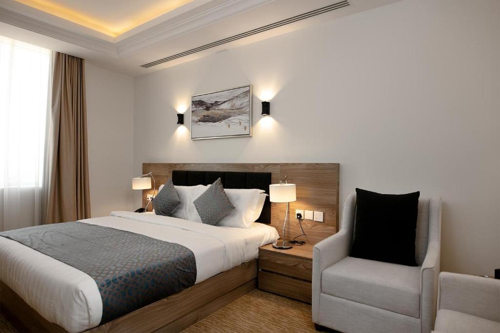 Postel nebo postele na pokoji v ubytování The Proud Hotel Al Khobar
