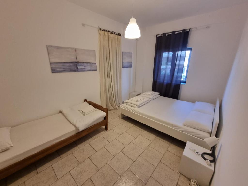 Łóżko lub łóżka w pokoju w obiekcie Lucas Lux Flogita apartment