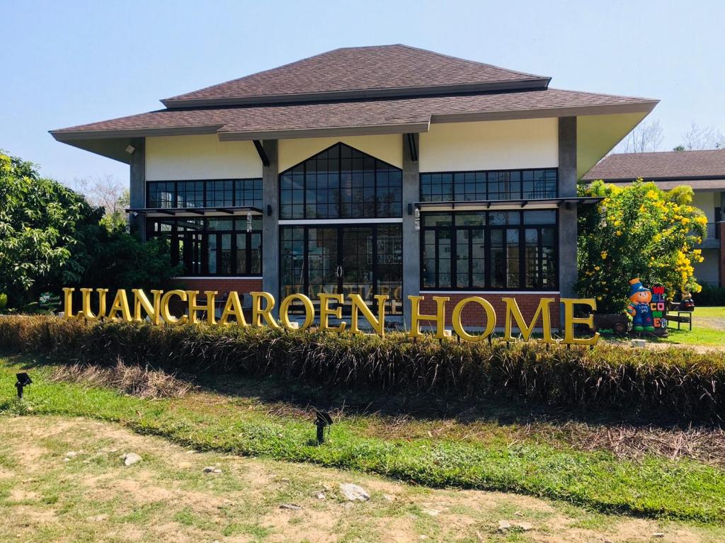 a house with a sign that reads immigration home at Luancharoen Home Resort Phuket in Thalang