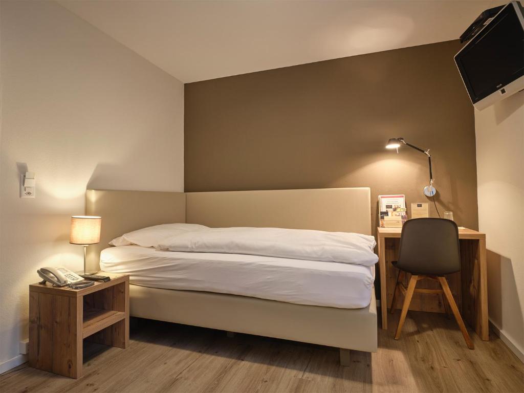Uma cama ou camas num quarto em Hotel Astoria