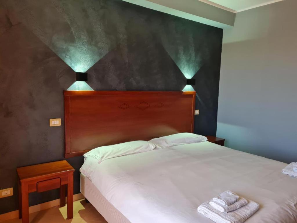 Postel nebo postele na pokoji v ubytování Città Della Notte