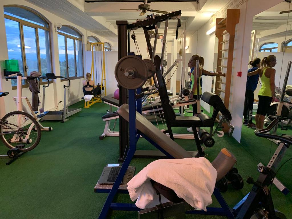 a gym with people working out in the gym at Winter Home G&D in Milano Marittima