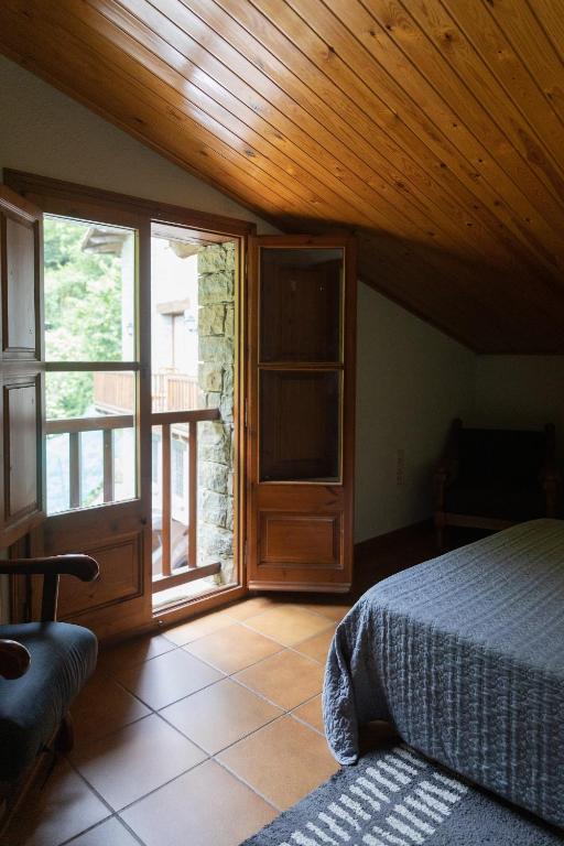 Postel nebo postele na pokoji v ubytování Casa Can Rufo de Rupit
