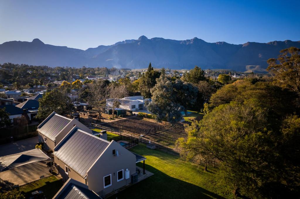 an aerial view of a house with mountains in the background at Dolittle Cottages in Swellendam