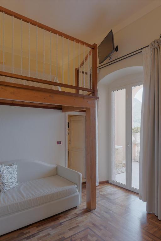 Giường trong phòng chung tại Palazzo Pischedda