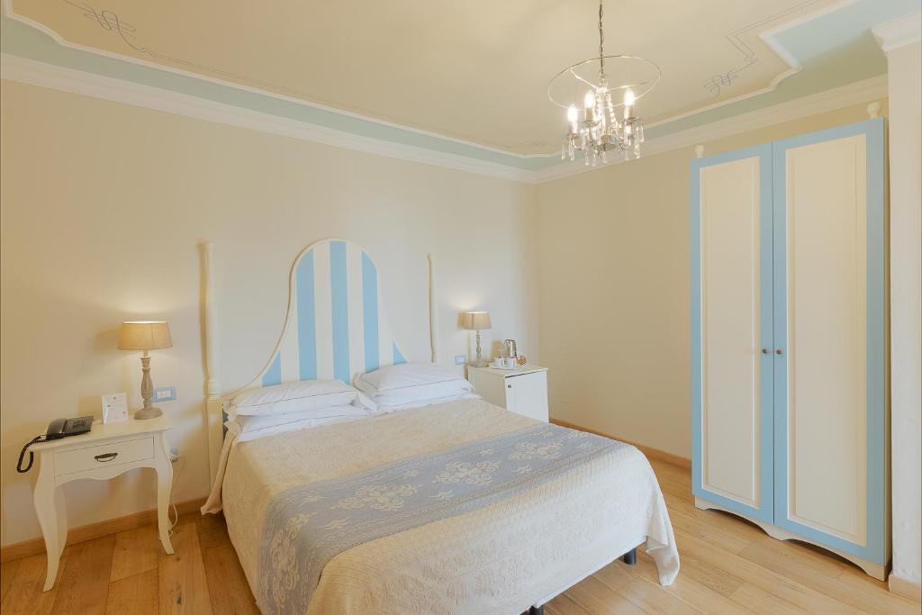 Giường trong phòng chung tại Palazzo Pischedda