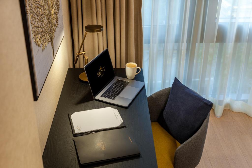 a laptop computer sitting on a desk in a room at Broyt Hotel in Istanbul