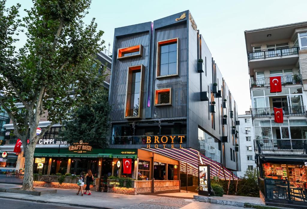 a building on a street with people walking in front of it at Broyt Hotel in Istanbul